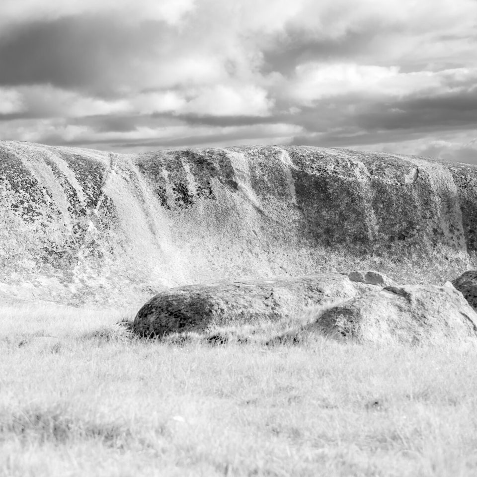 Liquid rocks and sky, the granite worn down over millennia.