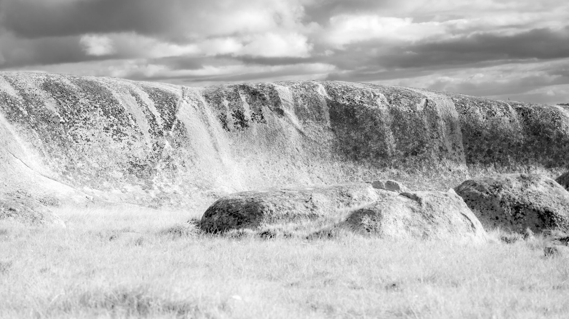 Liquid rocks and sky, the granite worn down over millennia.